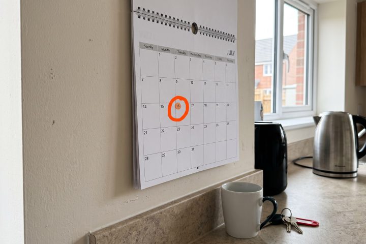 Wall calendar with a date circled in a new-build kitchen