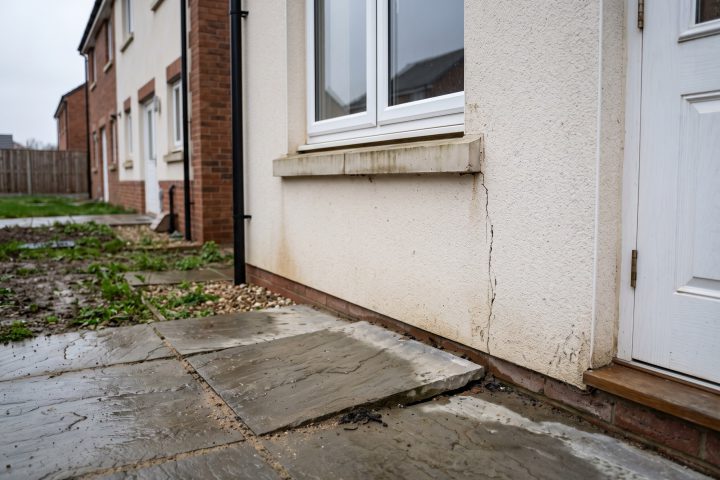 Cracked render at a window corner on a two-year-old new build